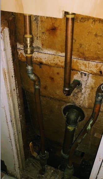 Corroded old galvanized and copper pipes before the repipe